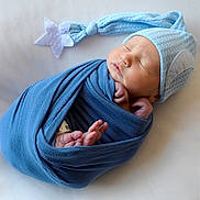 Dakari joined the competition — help win amazing prizes! newborn, baby, sleeping, wrapped, blue_blanket, hat, star, soft_texture, peaceful, infant, cute, portrait, cozy, lying_down, skin, headwear, tiny_feet, hands, close_up, resting