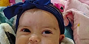 Justice joined the competition — help win amazing prizes! baby, headband, smile, infant, blanket, soft_toys, pink, blue, white_clothing, face, cheeks, eyes, portrait, cute, indoors, child, happy, closeup, cozy, baby_bow