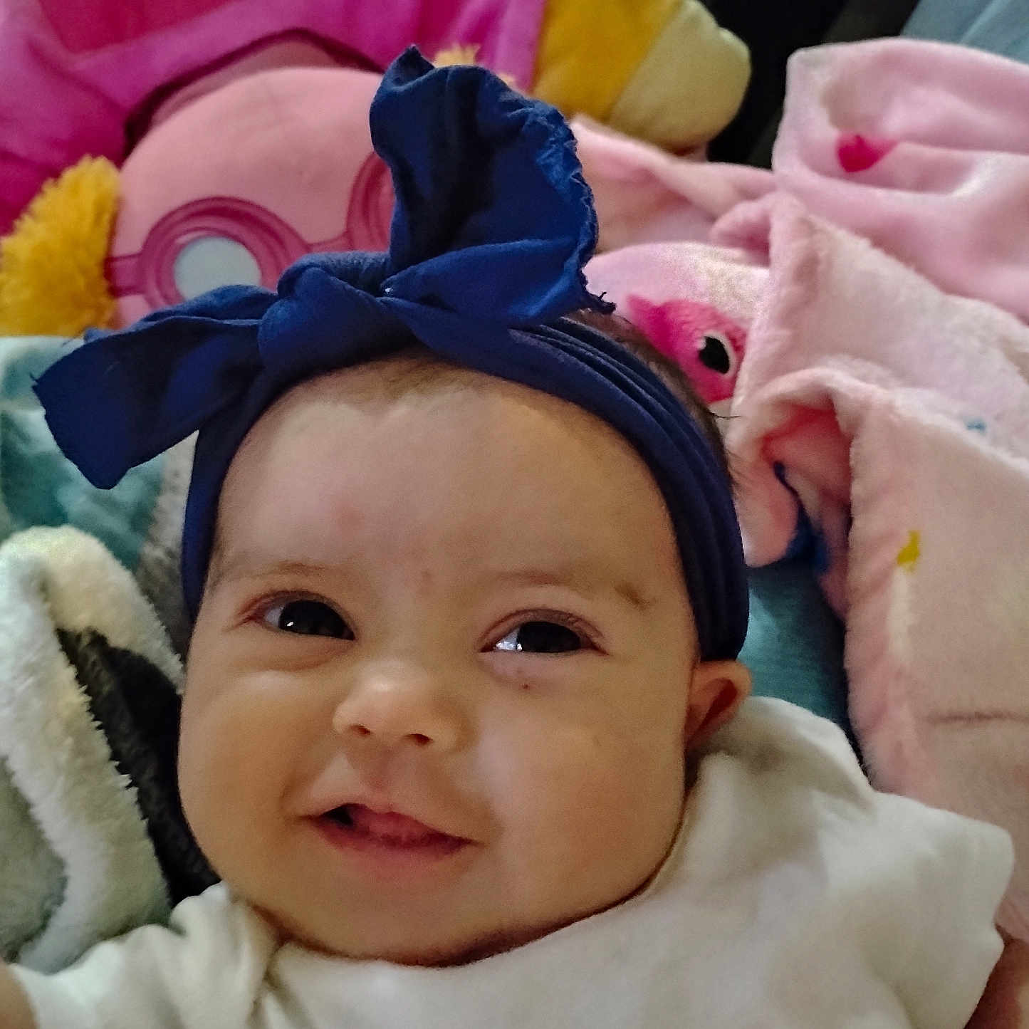 Justice joined the competition — help win amazing prizes! baby, baby_bow, blanket, blue, cheeks, child, closeup, cozy, cute, eyes, face, happy, headband, indoors, infant, pink, portrait, smile, soft_toys, white_clothing