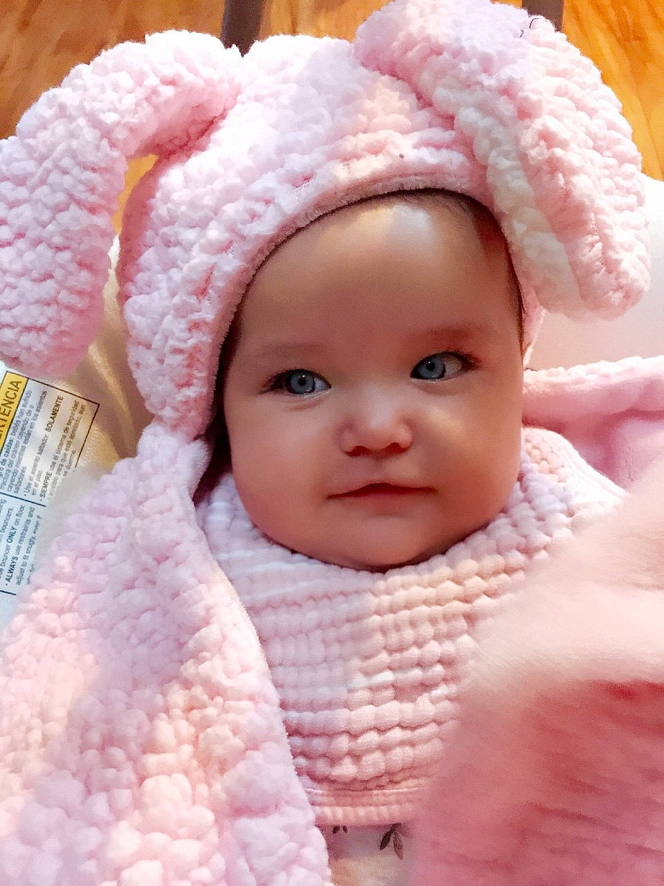 Kiera is registered to the contest to win money with this photo: baby, baby_toddler_clothing, cap, cheek, chin, eye, eyelash, face, headgear, headwear, human_body, knit_cap, lip, magenta, nose, person, pink, skin, sleeve, textile