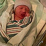 Jasper is registered to the contest to win money with this photo: newborn, baby, hospital, bassinet, blanket, hat, pacifier, sleeping, infant, wrapped, medical, bed, child, cute, person, resting, newborn_baby, hospital_room, sleep, toddler