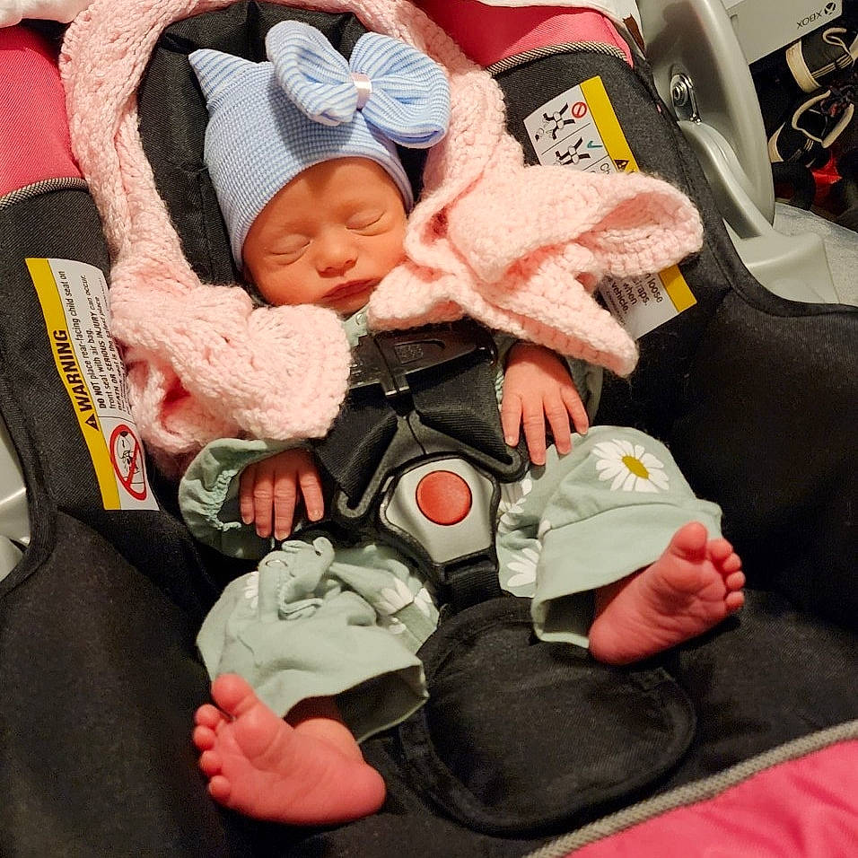 Mackenzie joined the competition — help win amazing prizes! baby, baby_carriage, baby_in_car_seat, baby_products, baby_safety, baby_sleeping, baby_toddler_clothing, car_seat, carmine, cheek, child, comfort, hat, headwear, lap, linens, nail, person, sitting, steering_wheel