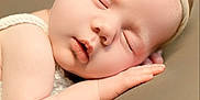 Evie joined the competition — help win amazing prizes! baby, sleeping, headband, bow, flower, infant, peaceful, soft, knitted, skin, closeup, resting, cute, adorable, child, portrait, hand, face, newborn, calm