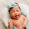 Harret Eloise is registered to the contest to win money with this photo: baby, infant, headband, flower, tongue_out, wrapped, blanket, cute, expression, face, skin, soft, cozy, newborn, chubby, fuzzy, cushion, hand, portrait, indoors
