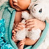 baby, sleeping, stuffed_toy, lamb, blanket, knit, blue_flower, hand, feet, cozy, soft, infant, cute, child, portrait, closeup, peaceful, resting, wrapped, toy