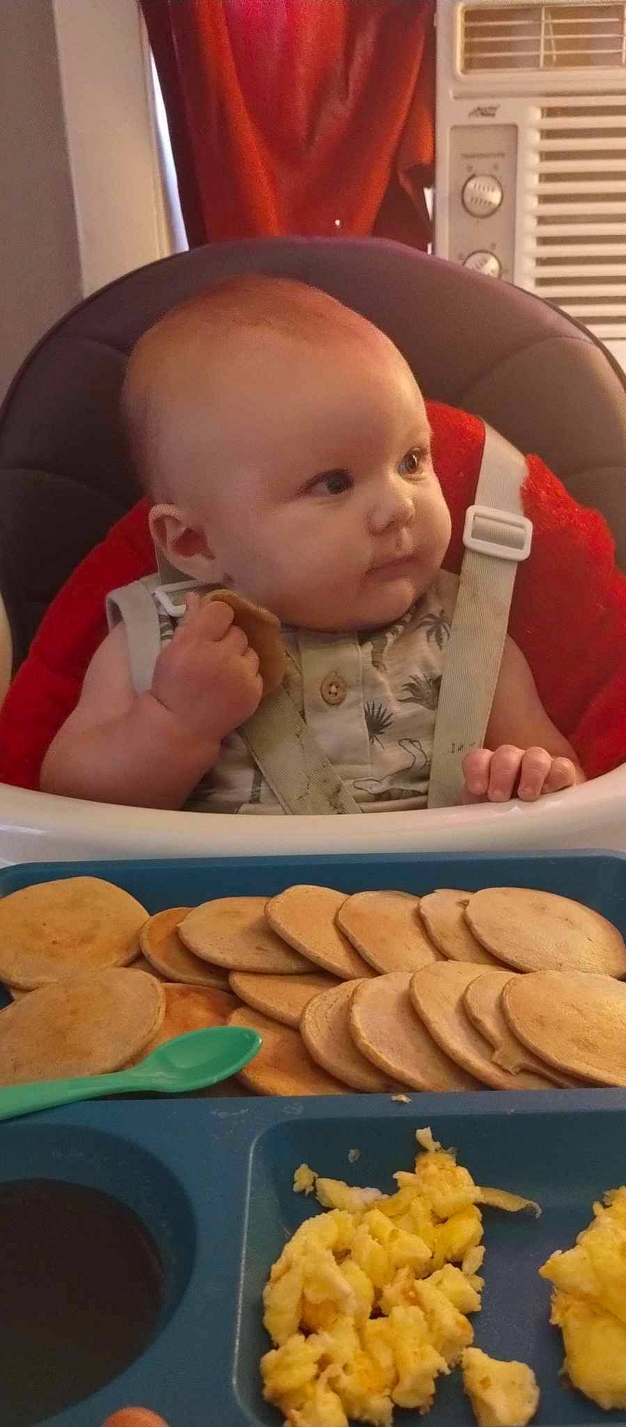 Mayson is registered to the contest to win money with this photo: baby, baby_products, baby_toddler_clothing, baking, bib, chair, cheek, child, comfort, comfort_food, cuisine, finger, finger_food, mouth, nose, person, sitting, skin, thumb, toddler