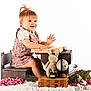 Lyana a rejoint le concours — aidez-le/la à gagner de superbes lots ! antique_books, book, child, childrens_furniture, cute, dress, flowers, globe, happy, indoor, knitted_bunny, pink_flowers, playing, portrait, smiling, toddler, toy_typewriter, white_background, wooden_desk, wooden_floor