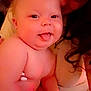 Hazelee joined the competition — help win amazing prizes! baby, child, tongue_out, playful, adult, holding, face, skin, expression, cute, closeup, indoors, person, warm_lighting, intimate, smile, hair, cheeks, hand, shoulder