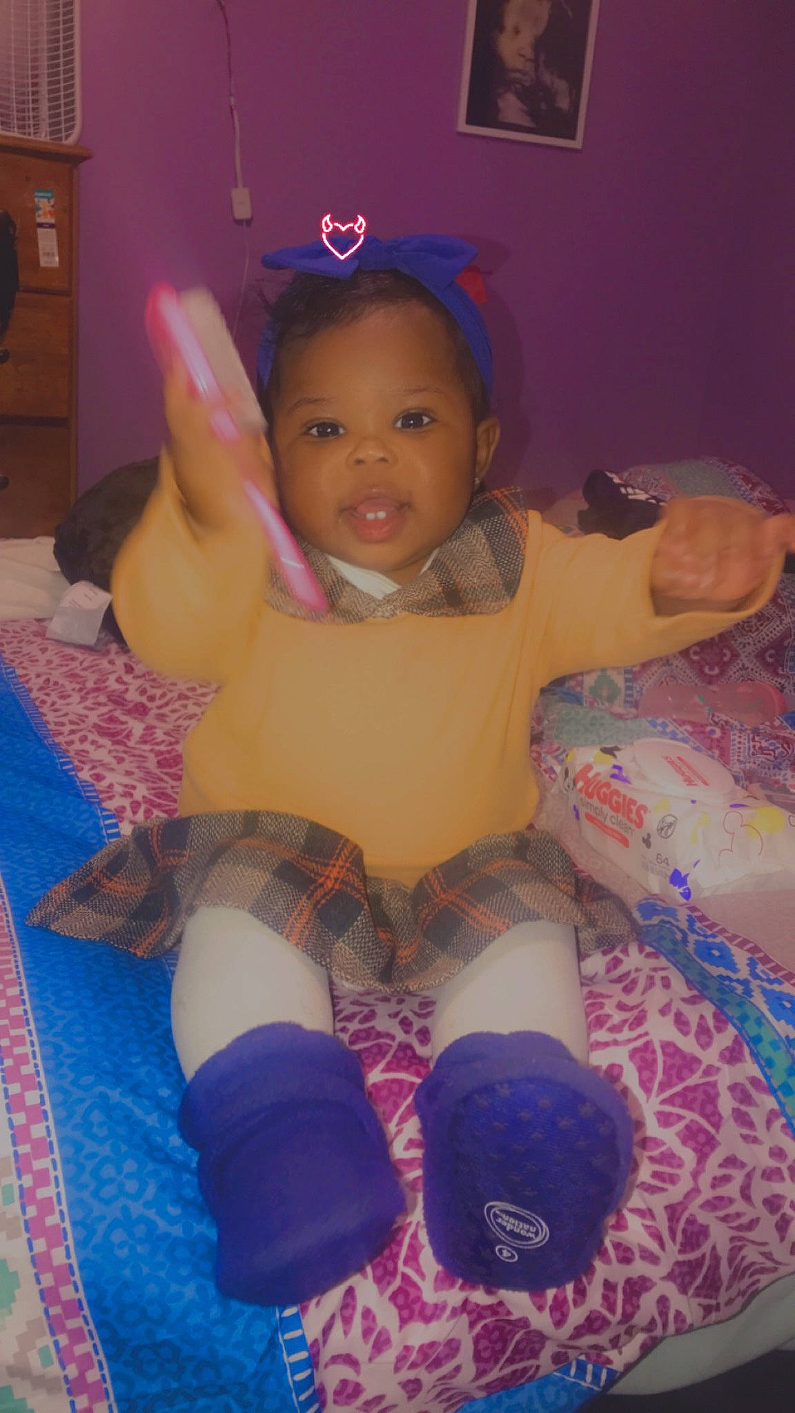 Ariyah is registered to the contest to win money with this photo: arm, baby_toddler_clothing, cabinetry, comfort, eye, finger, happy, human_body, iris, leg, mammal, mouth, person, pink, purple, skin, smile, textile, thigh, toddler