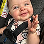 baby, child, smiling, car_seat, seatbelt, blue_eyes, pink_clothing, hello_kitty, denim, cute, happy, infant, hand, face, headband, person, safety, young, portrait, closeup