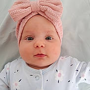 Amelie is registered to the contest to win money with this photo: accessories, applique, baby, beanie, bonnet, cap, clothing, face, hat, head, headband, knitwear, newborn, pattern, person, photography, portrait, scarf, sweater, turban