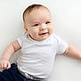 baby, infant, smile, white_onesie, chubby_cheeks, lying_down, cute, happy, child, young, skin, head, arms, hands, clothing, portrait, person, light_background, casual, expression