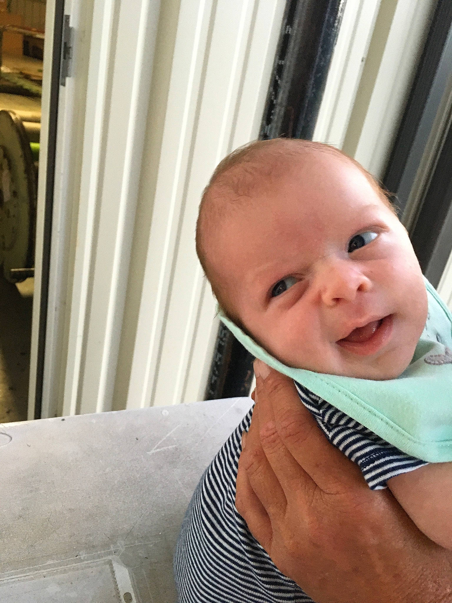 Landin is registered to the contest to win money with this photo: baby, baby_toddler_clothing, bib, cheek, collar, eye, eyebrow, eyelash, finger, lip, mammal, nail, person, skin, tooth