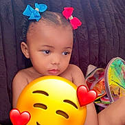 Sakura joined the competition — help win amazing prizes! child, toddler, hair_bows, blue_bow, red_bow, couch, plush_couch, toy, sippy_cup, indoor, diaper, young_child, cute, seated, cute_expression, emoji_overlay, colorful, playtime, relaxed, home