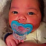 Saniyah is registered to the contest to win money with this photo: baby, newborn, pacifier, blue, blanket, closeup, face, hand, infant, cute, cozy, sleepwear, skin, expression, portrait, child, young, lying, comfort, indoors