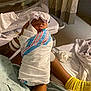 Saniyah joined the competition — help win amazing prizes! newborn, baby, hospital, blanket, swaddled, sleeping, hat, bow, adult, hand, hospital_gown, bed, socks, patient, room, curtains, medical, resting, infant, portrait