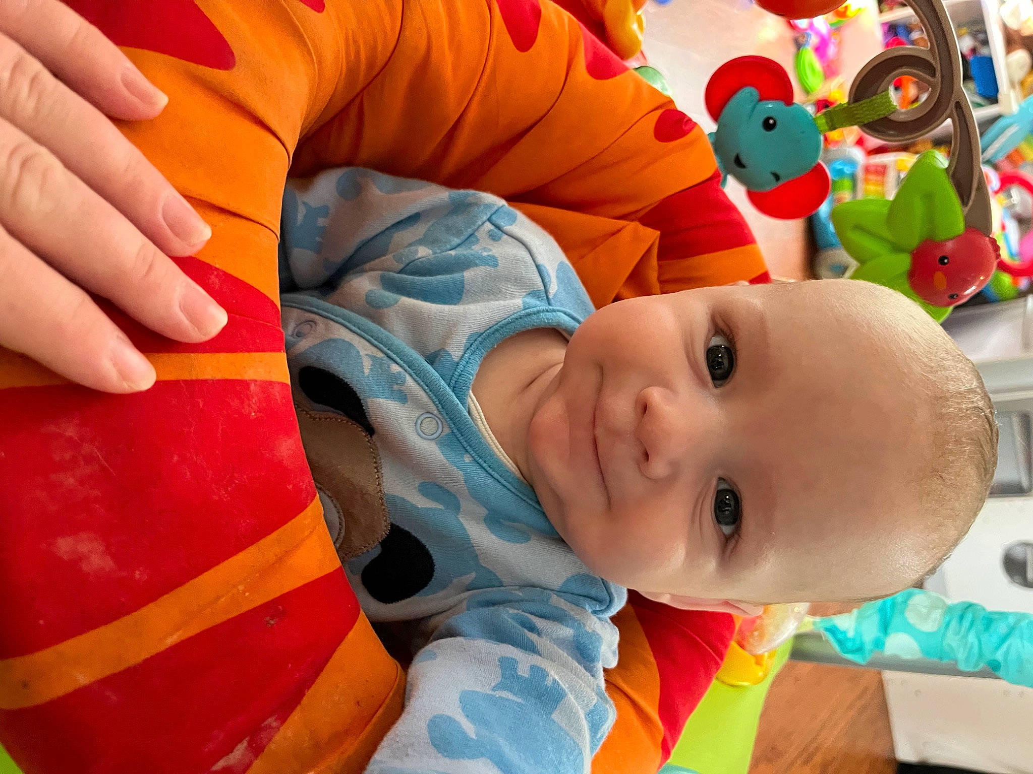 Logan is registered to the contest to win money with this photo: baby, baby_products, baby_toddler_clothing, baby_toys, cheek, child, comfort, fun, happy, head, joy, leisure, linens, nose, orange, person, play, room, smile, textile