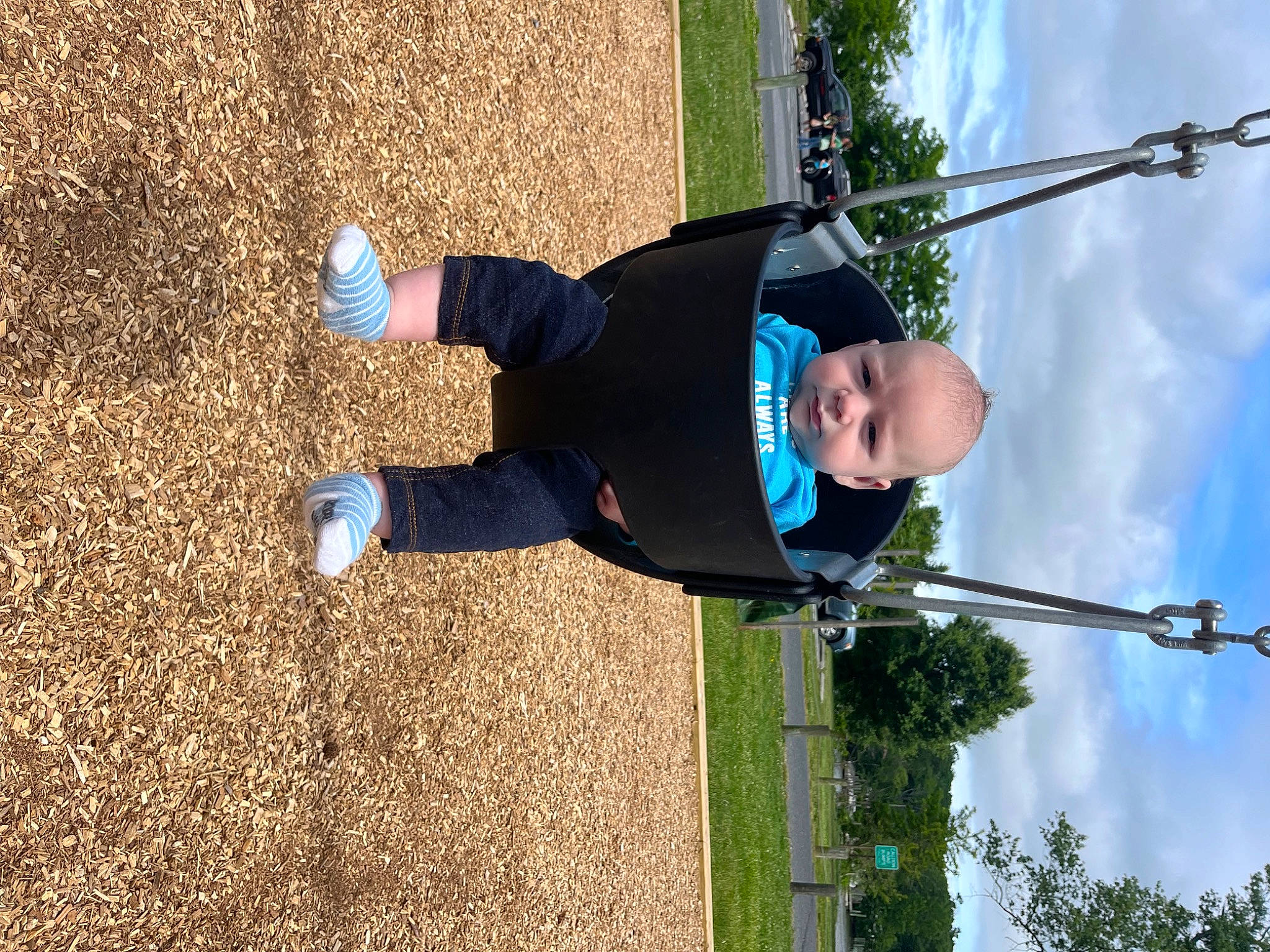 Logan is registered to the contest to win money with this photo: cloud, elbow, electric_blue, fun, grass, hat, leisure, people_in_nature, person, plant, pole, recreation, rope, shadow, sky, soil, t_shirt, tree, walking_shoe