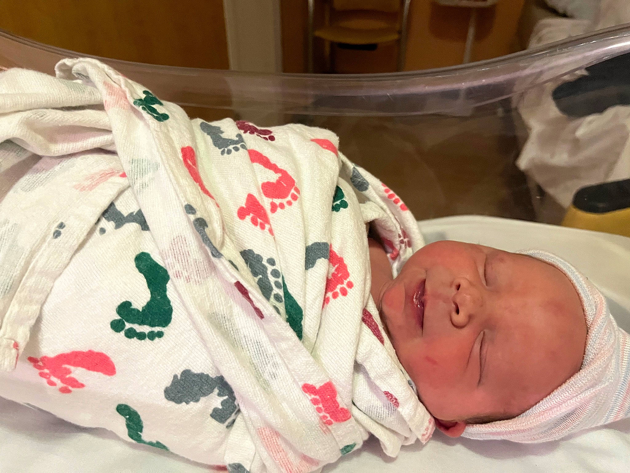 Logan is registered to the contest to win money with this photo: baby, baby_products, baby_safety, baby_sleeping, baby_toddler_clothing, bed_sheet, bedding, bedtime, carmine, child, comfort, creative_arts, hat, hospital, linens, pattern, person, room, sleep, sleeve