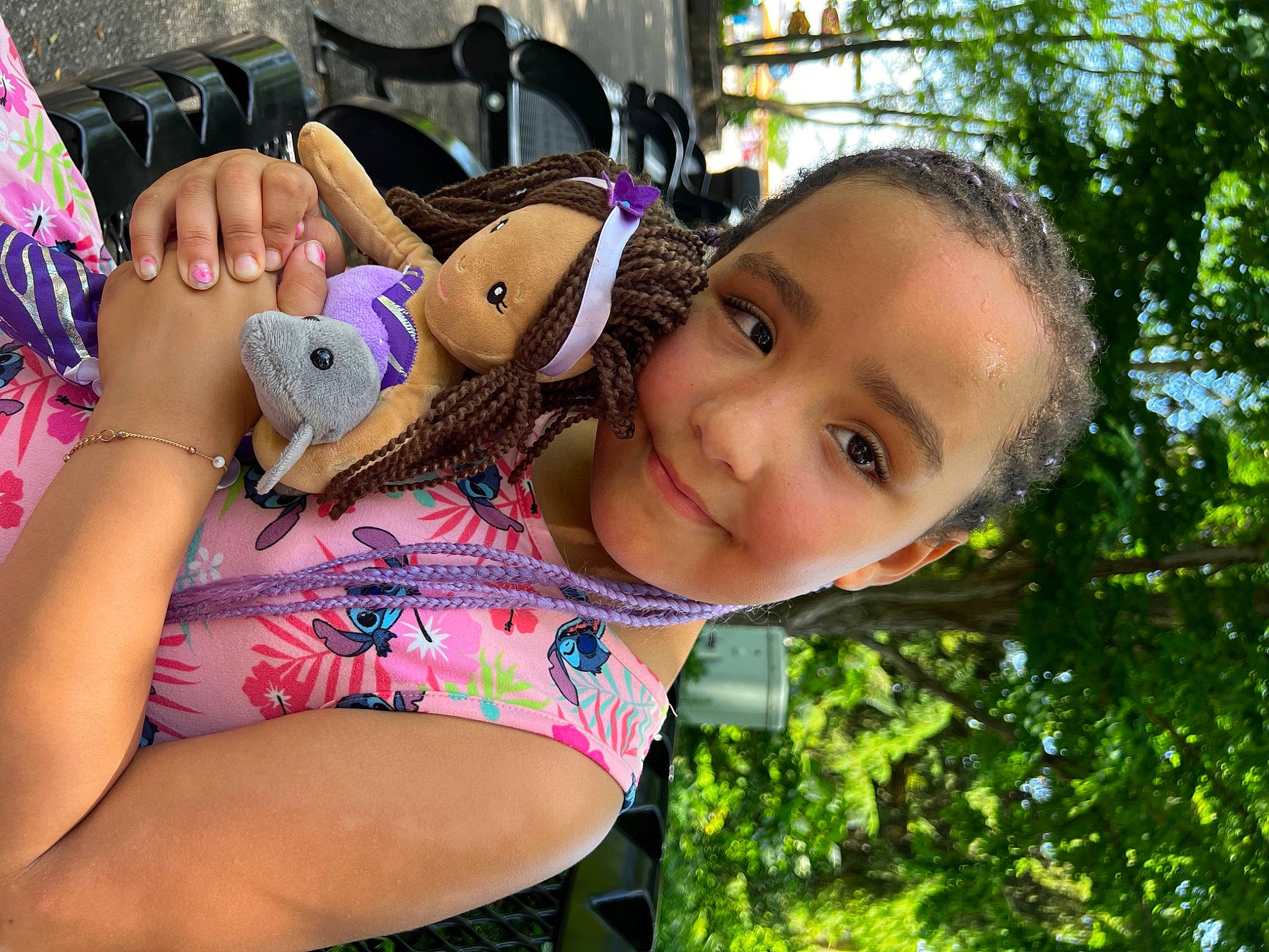 Malaya is registered to the contest to win money with this photo: child, eyewear, fun, grass, happy, joy, leisure, magenta, people_in_nature, person, pink, play, recreation, sitting, skin, smile, stuffed_toy, t_shirt, toddler, toy