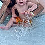 Keaton joined the competition — help win amazing prizes! toddler, child, adult, tattoo, water, splash, pool, swimming, playing, happy, summer, fun, barefoot, skin, hand, face, orange_shorts, wet, outdoor, joy