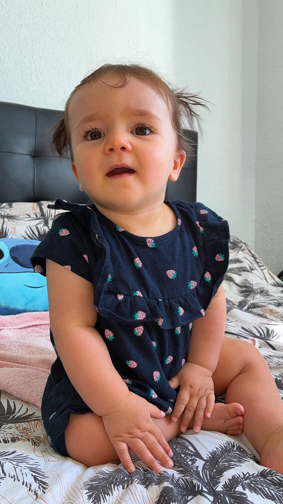 Lana a rejoint le concours — aidez-le/la à gagner de superbes lots ! toddler, child, baby, face, hands, legs, dress, pigtails, bed, bedding, pattern, strawberry_print, curious, indoor, person, skin, hair, expression, seated, furniture