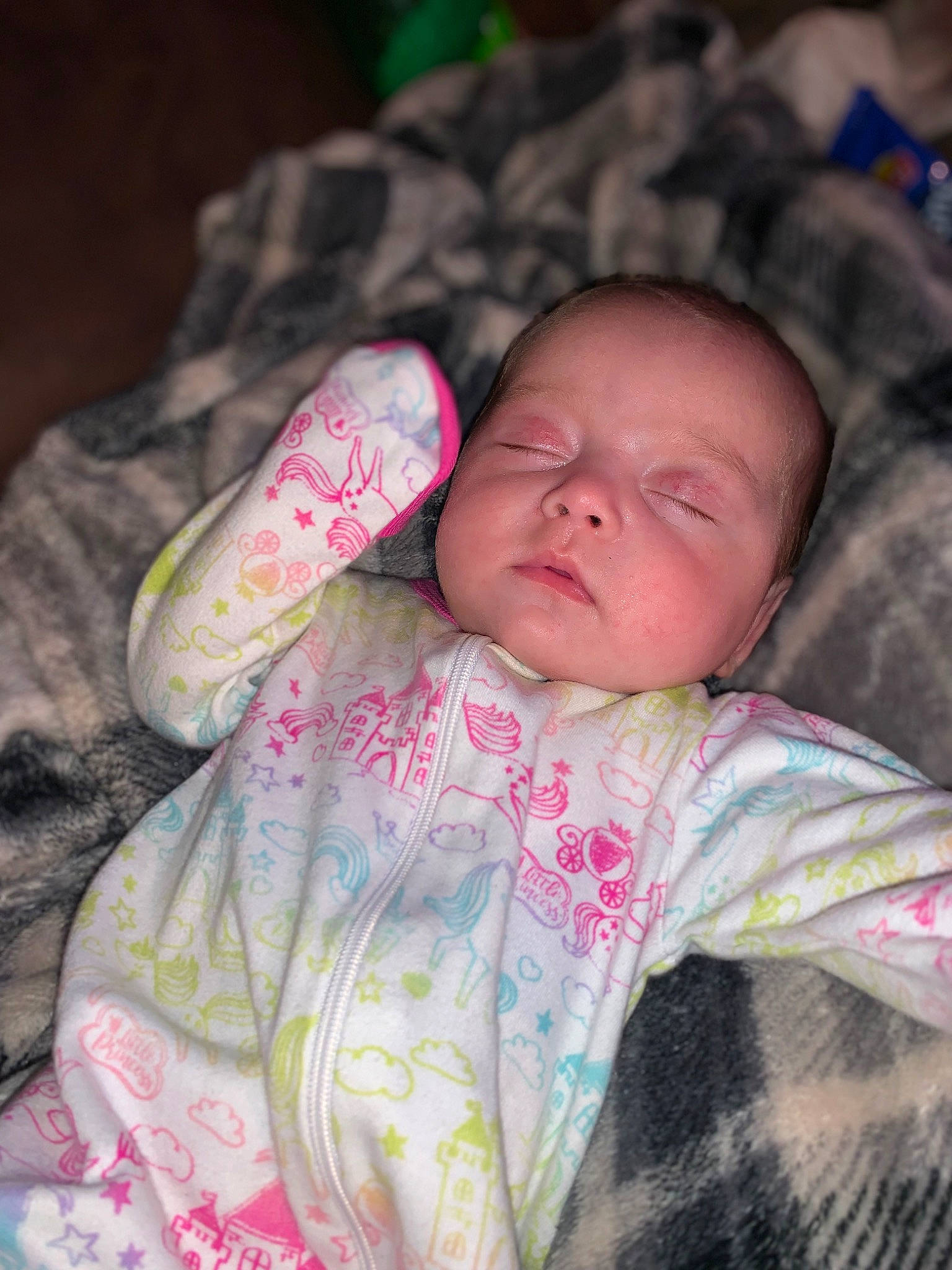 Raelynn is registered to the contest to win money with this photo: baby, baby_toddler_clothing, cheek, child, comfort, eye, face, finger, head, linens, lip, mammal, mouth, nose, person, pink, skin, sleeve, textile, toddler
