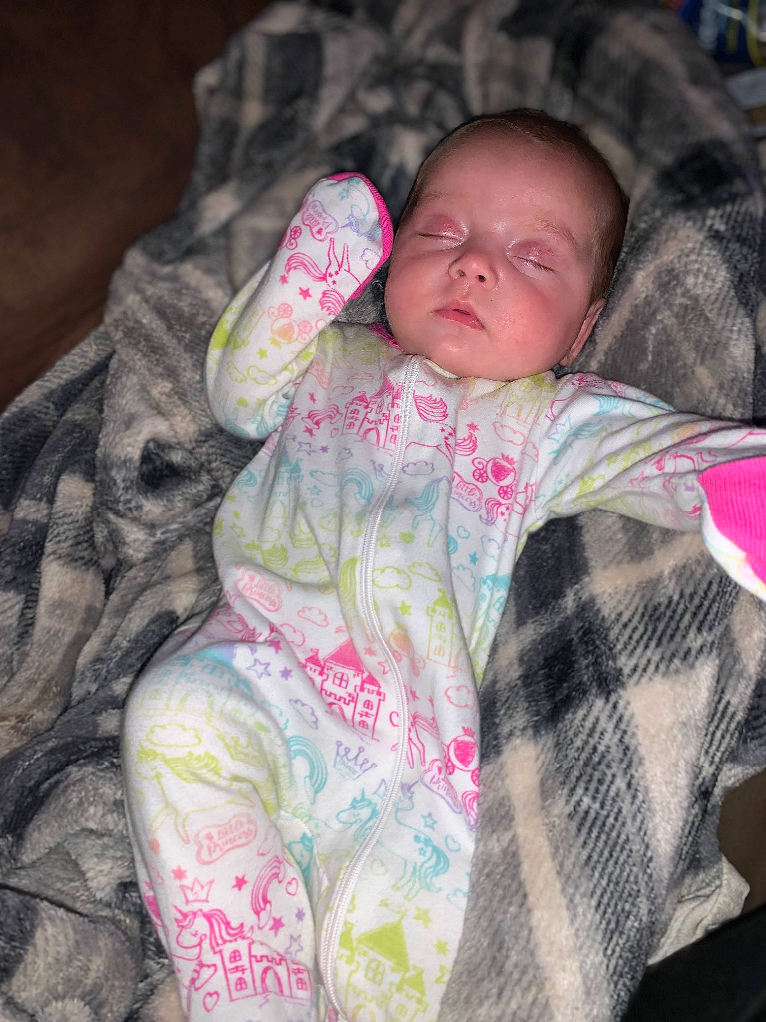 Raelynn is registered to the contest to win money with this photo: baby, baby_products, baby_toddler_clothing, bedtime, cheek, child, comfort, eye, grass, head, linens, nap, nose, pattern, person, pink, sitting, skin, sleeve, textile