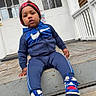 Kartier joined the competition — help win amazing prizes! child, toddler, blue_tracksuit, sneakers, knit_hat, outdoor, steps, porch, house, white_door, wooden_floor, casual_clothing, curious_expression, person, young_child, daylight, sitting, front_view, urban, portrait