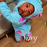 Kartier is registered to the contest to win money with this photo: toddler, child, costume, blue, pink, playpen, wooden_floor, curious, indoors, baby, person, cute, wide_eyes, floor, cardboard_box, home, clothing, portrait, infant, expression