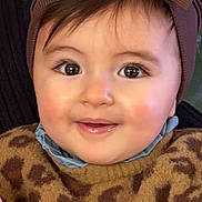 Ava participe au concours pour gagner de l'argent avec cette photo : baby, bow, child, closeup, clothing, cute, eyes, face, fuzzy, happy, headband, headwear, indoor, leopard_print, person, portrait, smile, sweater, warm, young_child