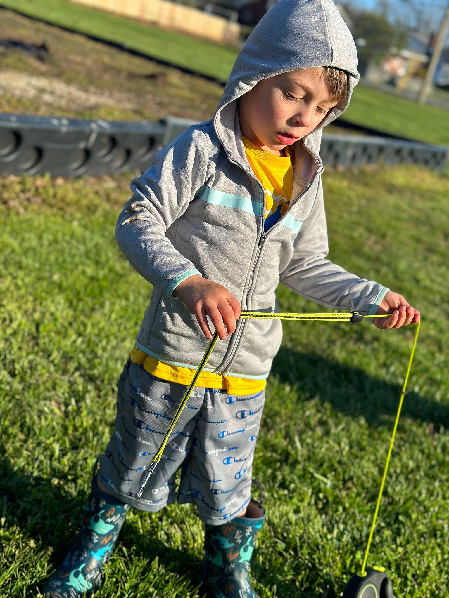 Kobe joined the competition — help win amazing prizes! adventure, cap, child, clothing, fun, grass, grassland, happy, headwear, hoodie, landscape, leisure, outdoor_recreation, people_in_nature, person, plant, play, recreation, rock_climbing_equipment, rope