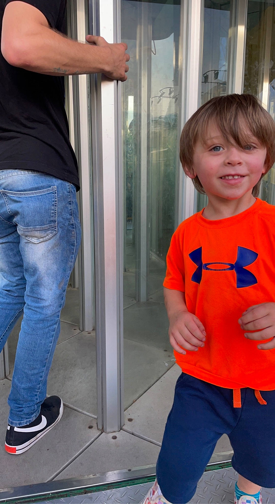 Kobe is registered to the contest to win money with this photo: baby_toddler_clothing, blue, clothing, denim, electric_blue, fashion, human_leg, joint, joy, orange, person, product, shoulder, sleeve, smile, spider_man, sportswear, standing, t_shirt, thigh