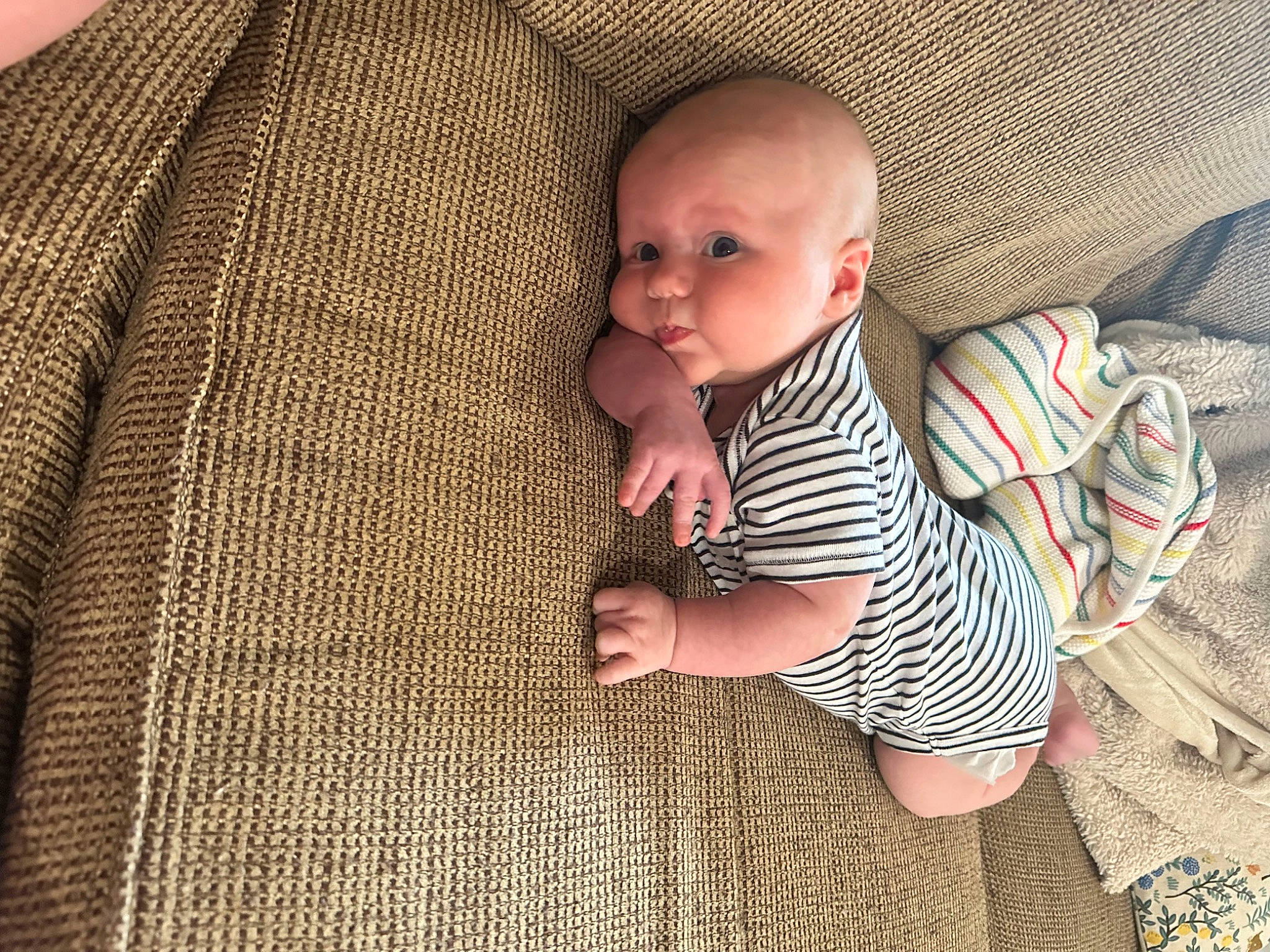 Hayes joined the competition — help win amazing prizes! baby, baby_products, baby_toddler_clothing, cheek, child, comfort, finger, flooring, foot, linens, pattern, person, sitting, skin, sleeve, t_shirt, textile, toddler, wood, wool