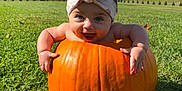Elara is registered to the contest to win money with this photo: baby, pumpkin, headband, grass, outdoor, autumn, milestone, smile, child, nature, sky, clouds, tree, greenery, cute, seasonal, photography, infant, happy, playful