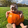 baby, pumpkin, headband, grass, outdoor, autumn, milestone, smile, child, nature, sky, clouds, tree, greenery, cute, seasonal, photography, infant, happy, playful