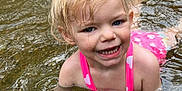 Gianna joined the competition — help win amazing prizes! baby, clothing, face, happy, head, laughing, leisureactivities, lifejacket, nature, outdoors, person, photography, pool, portrait, sport, summer, swimming, swimwear, water, watersports
