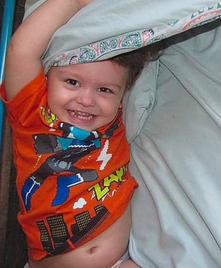 Anthony is registered to the contest to win money with this photo: baby, cap, child, fun, headgear, headwear, joy, neck, person, play, product, smile, toddler