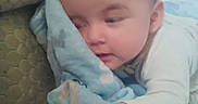 Ruthanne joined the competition — help win amazing prizes! baby, blanket, child, comfort, couch, cozy, face, hand, indoors, infant, laying, person, plush, resting, sleepy, soft, toddler, warm, wearing, young