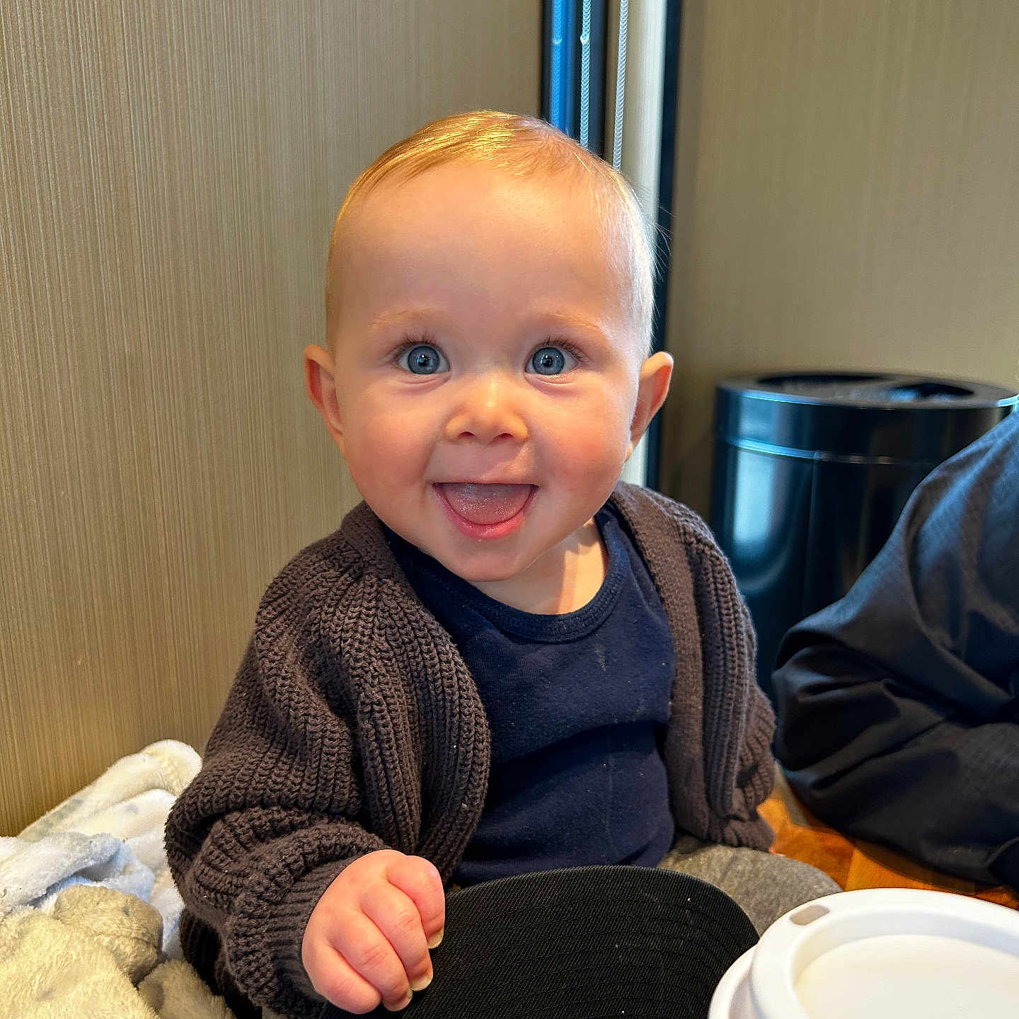 Charlee joined the competition — help win amazing prizes! adult, baby, bodypart, clothing, cutlery, face, finger, hand, happy, head, knitwear, male, man, pants, person, photography, portrait, sitting, smile, sweater