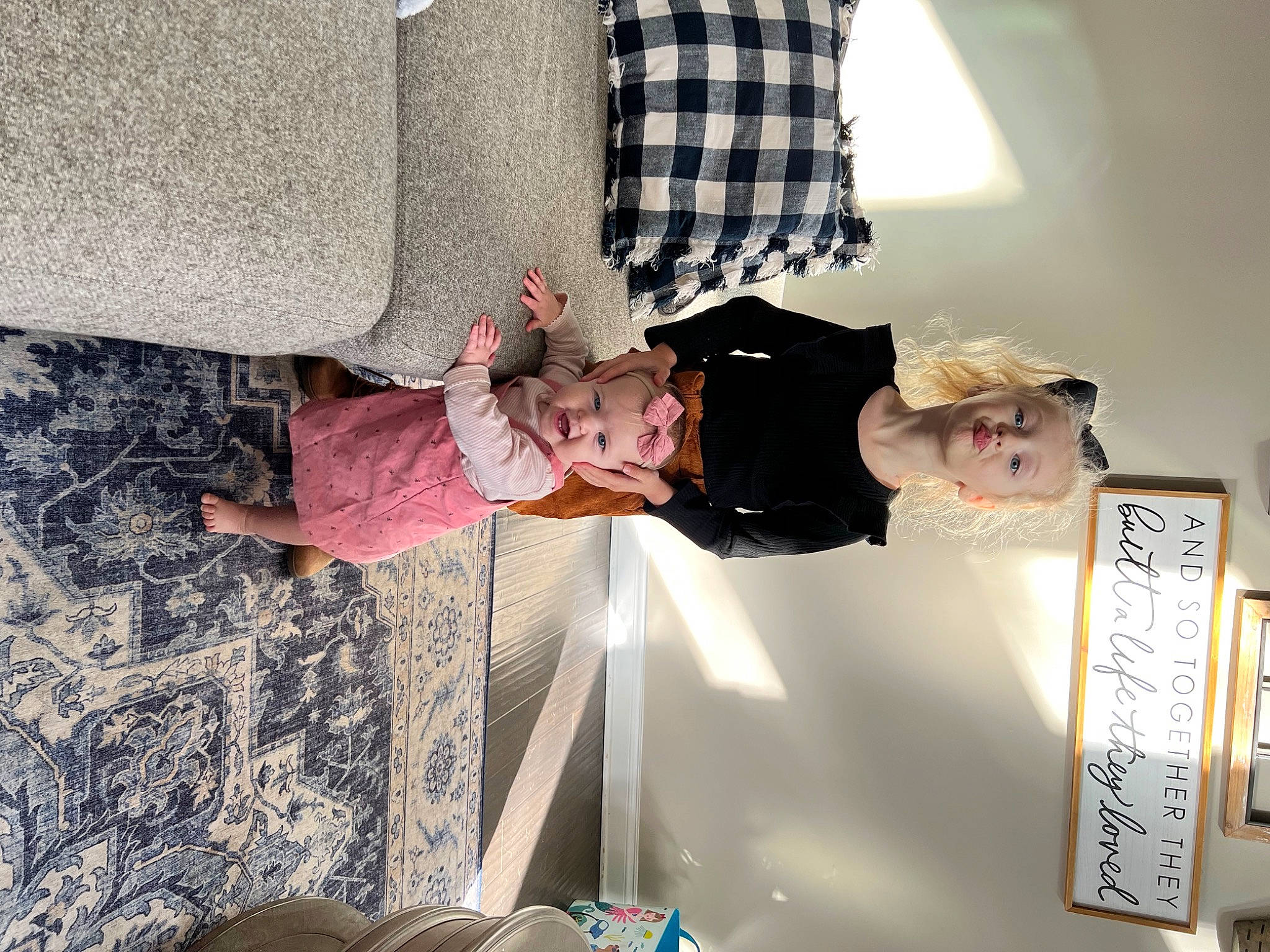 Kennedy joined the competition — help win amazing prizes! baby, baby_toddler_clothing, child, dress, flooring, fun, pattern, person, plaid, room, tartan, textile, toddler, tree, wood