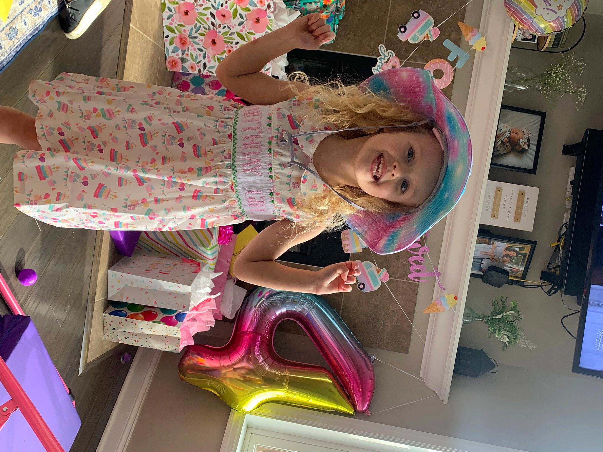 Kennedy is registered to the contest to win money with this photo: art, baby_toddler_clothing, child, fashion_design, fun, headwear, joy, magenta, pattern, person, pink, room, smile, thigh, toddler, visual_arts