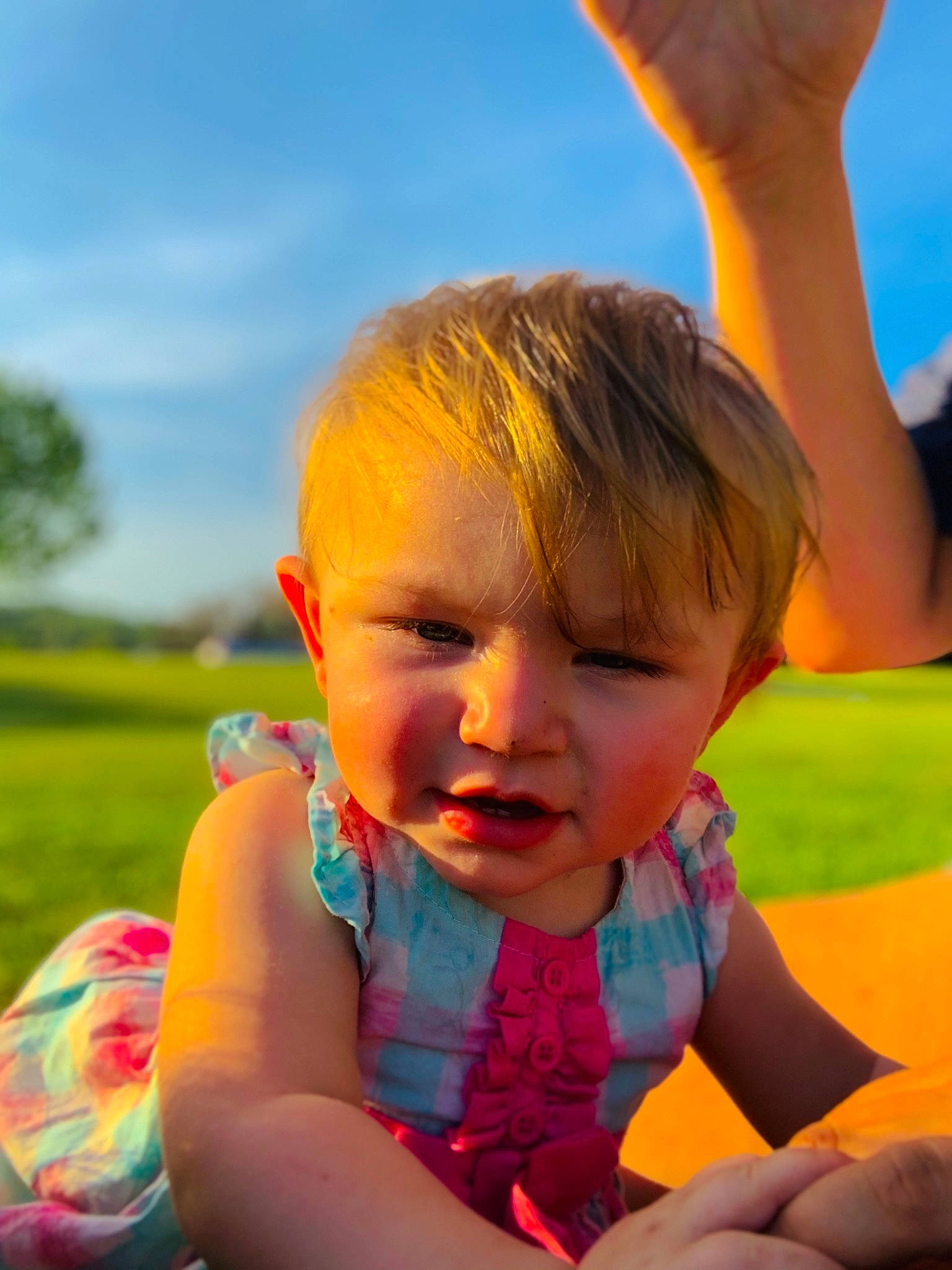 Kensleigh joined the competition — help win amazing prizes! arm, azure, baby, baby_toddler_clothing, facial_expression, finger, gesture, hand, happy, head, iris, leaf, light, nose, orange, people_in_nature, person, photograph, skin, sky