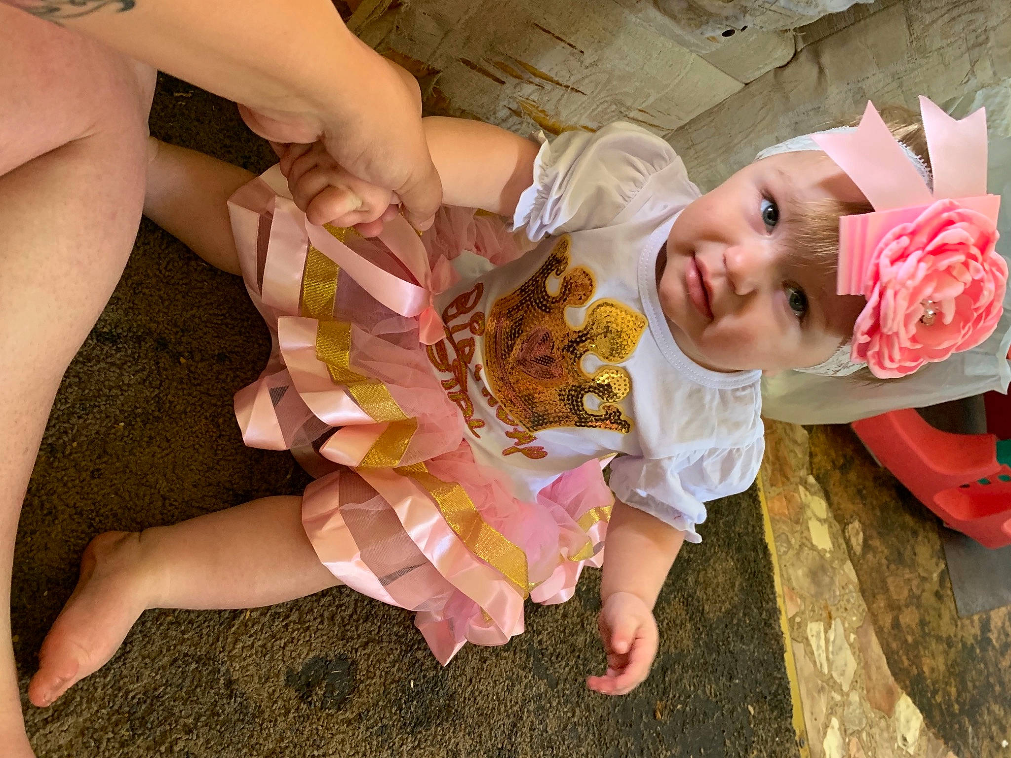Kensleigh joined the competition — help win amazing prizes! baby, baby_toddler_clothing, child, dress, finger, foot, fun, gesture, happy, hat, headband, headpiece, headwear, human_leg, nail, peach, person, pink, thigh, thumb