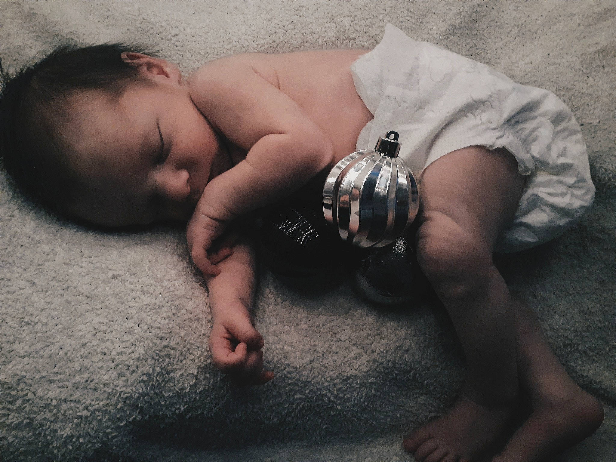 Evan is registered to the contest to win money with this photo: baby, barechested, barefoot, chest, child, comfort, elbow, finger, flash_photography, floor, flooring, foot, grass, hand, head, human_body, human_leg, person, skin, toddler