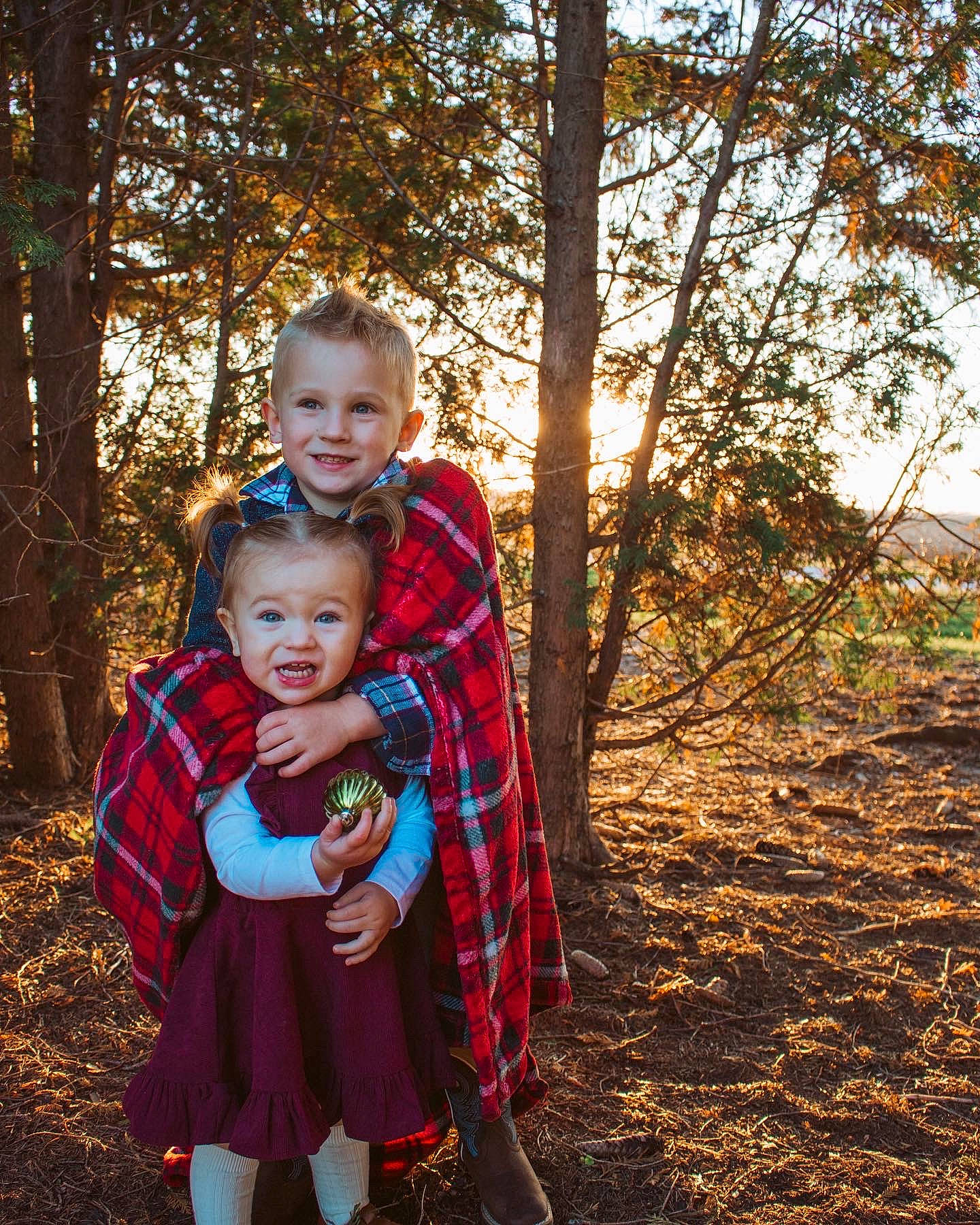 Sutton joined the competition — help win amazing prizes! branch, child, deciduous, forest, fun, grass, happy, joy, leisure, magenta, people_in_nature, person, plaid, plant, recreation, smile, sunlight, tartan, toddler, tree