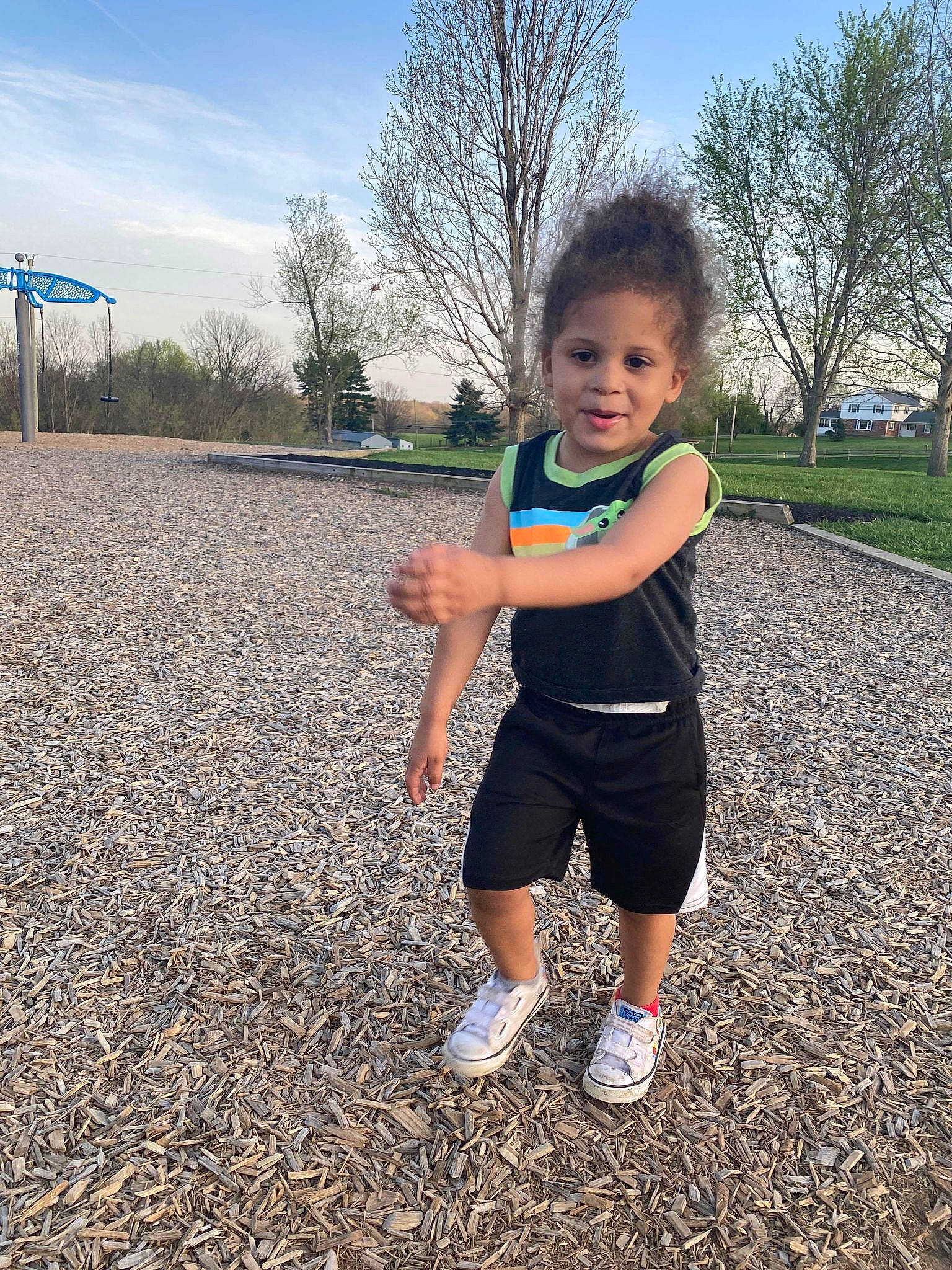 Isaiah is registered to the contest to win money with this photo: arm, asphalt, cool, gesture, grass, hair, happy, head, leaf, leg, leisure, people_in_nature, person, plant, shoe, shorts, sky, sunlight, toddler, tree