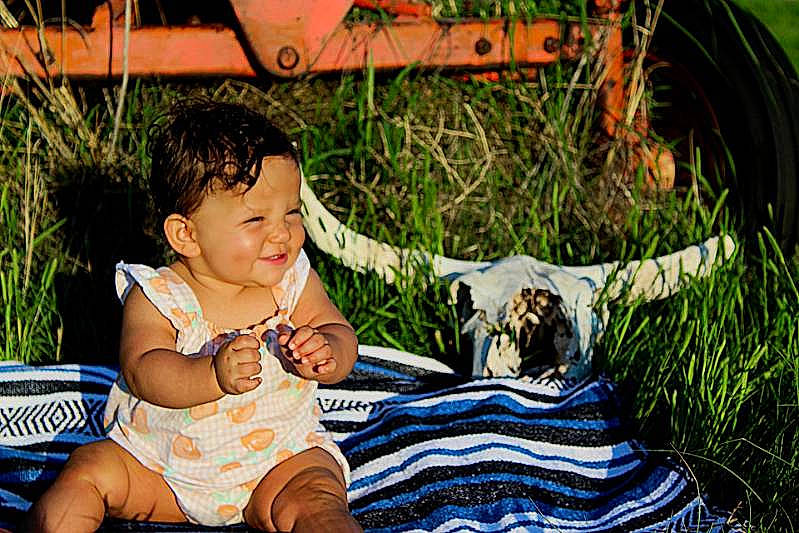 Casey joined the competition — help win amazing prizes! automotive_tire, baby, baby_toddler_clothing, barefoot, child, companion_dog, fun, fur, grass, happy, joy, leisure, mammal, people_in_nature, person, plant, recreation, sitting, smile, toddler