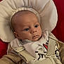 Isaac a rejoint le concours — aidez-le/la à gagner de superbes lots ! baby, infant, face, eyes, seat, straps, bib, clothing, cushion, comfort, indoor, portrait, child, newborn, expression, closeup, person, cute, soft, warm