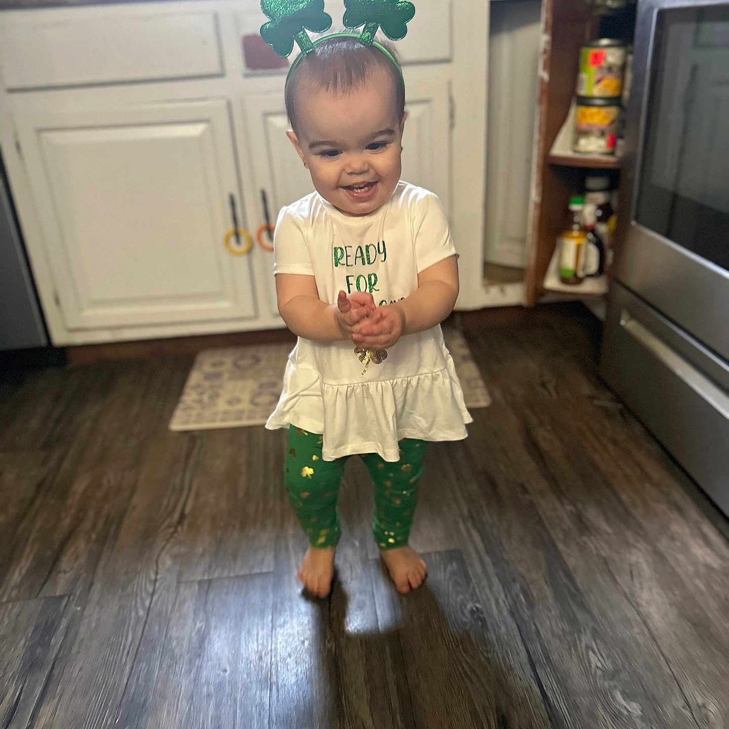 Ellianna is registered to the contest to win money with this photo: baby, can, clothing, dress, face, hardwood, head, indoors, interiordesign, pants, person, photography, plant, portrait, pottedplant, sitting, sleeve, standing, tin, wood